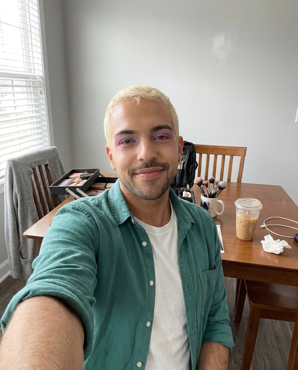 Danny Rose, makeup artist, photographed at a client's flat with his kit open