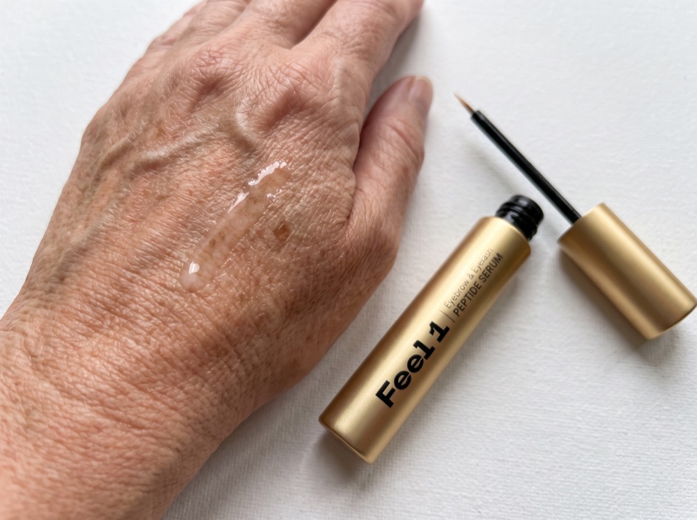 Swatch of the Feel1 peptide serum on the back of a hand