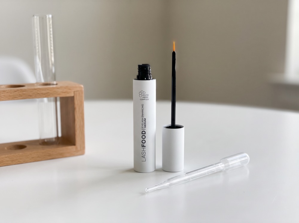 LashFood Phyto-Medic Eyelash Enhancer on the test bench with pipette and test tube