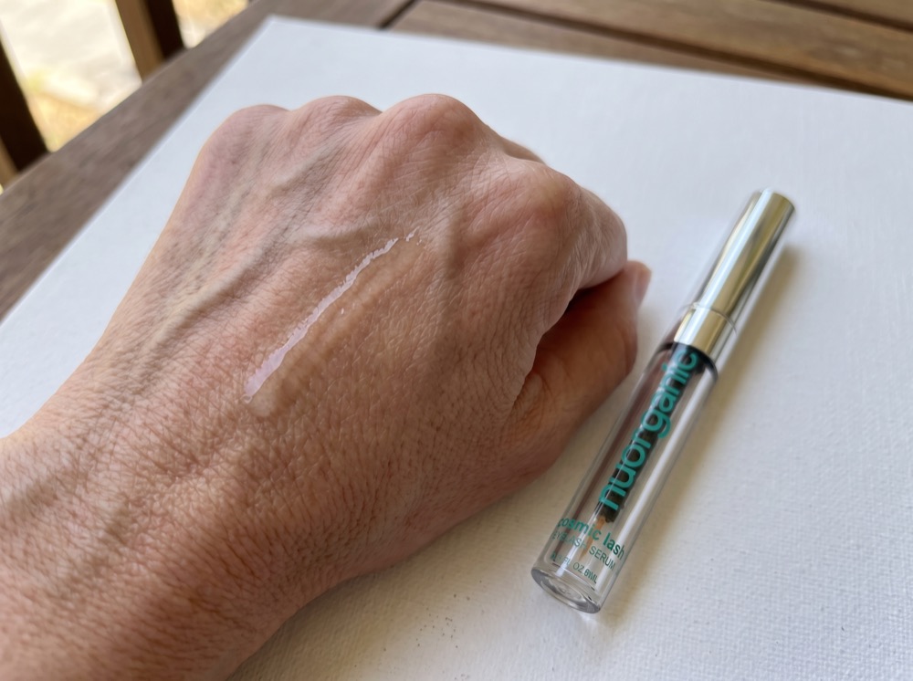 Serum swatch of NuOrganic Cosmic Lash Serum on the back of a hand