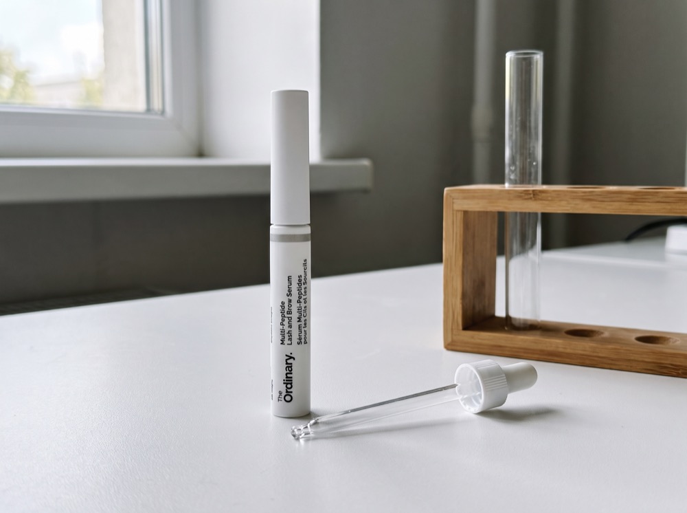 The Ordinary Multi-Peptide Lash and Brow Serum on the test bench with pipette and test tube