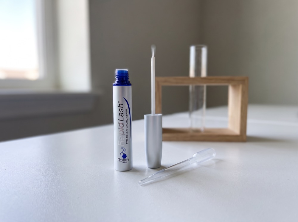 RapidLash Eyelash Enhancing Serum on the test bench with pipette and test tube