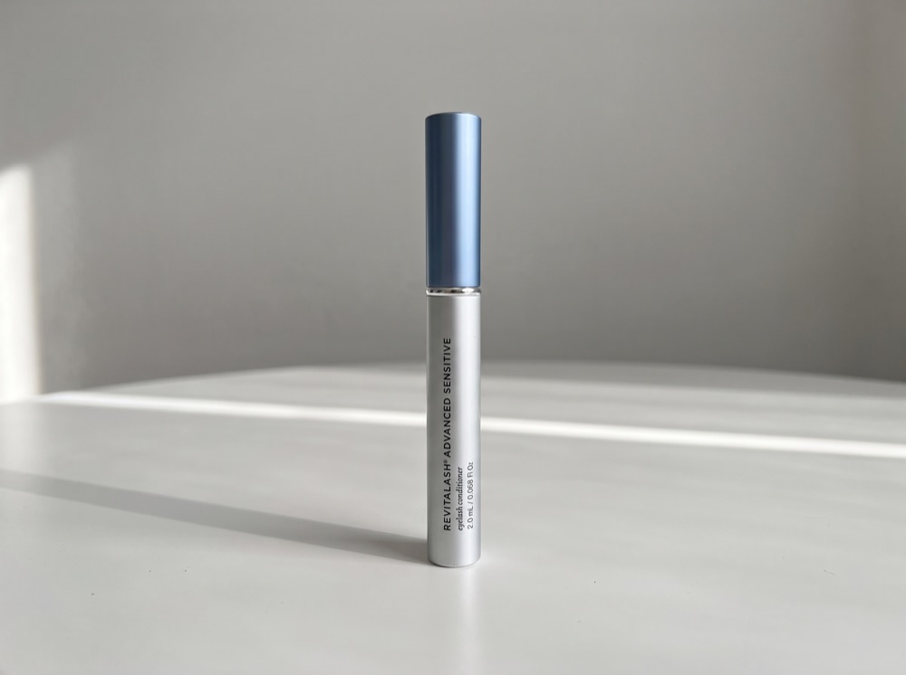 RevitaLash Advanced Eyelash Conditioner standing on a white tabletop