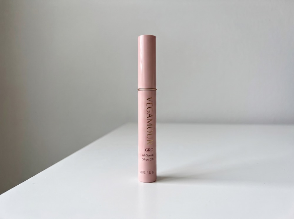 Vegamour GRO Lash Serum standing on a white tabletop