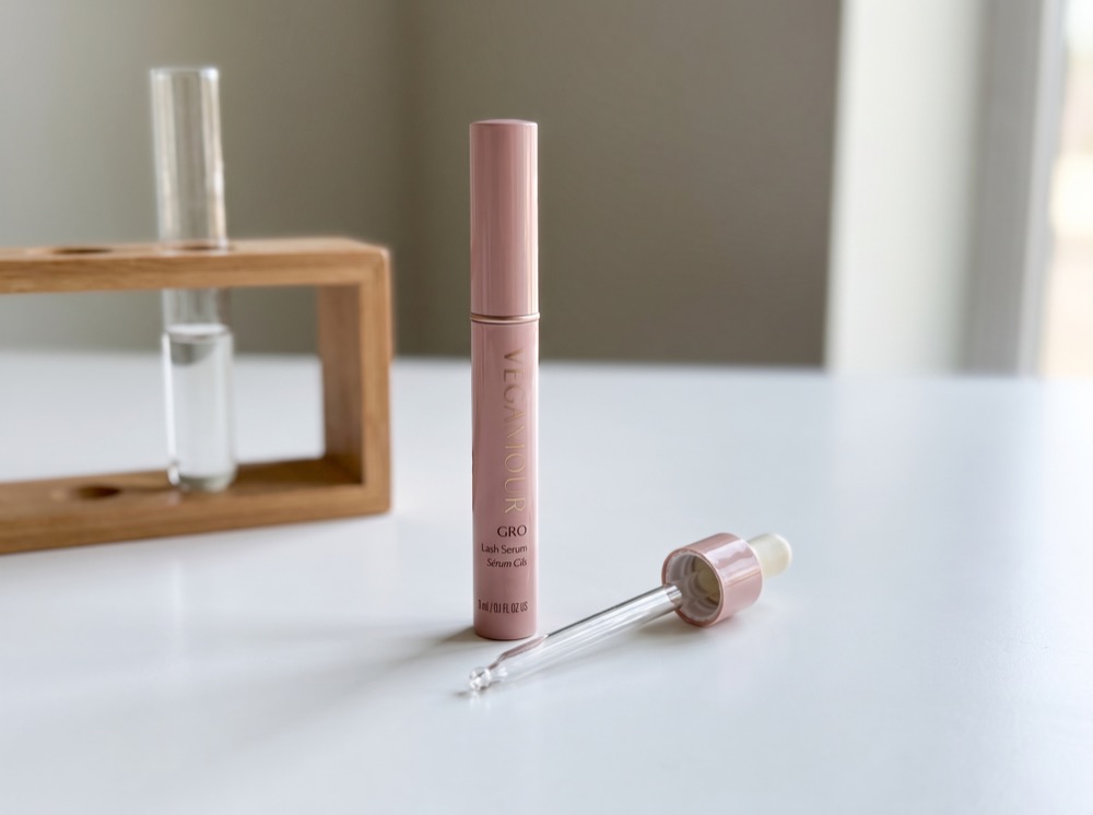 Vegamour GRO Lash Serum on the test bench with pipette and test tube